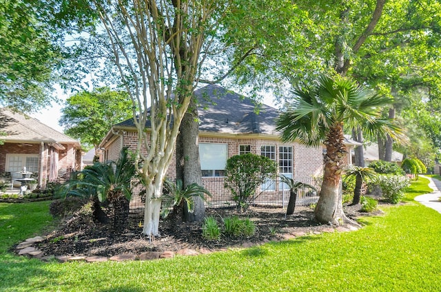 7 Champion Villa Dr, Houston, TX 77069 - view of home's exterior with brick siding and a lawn