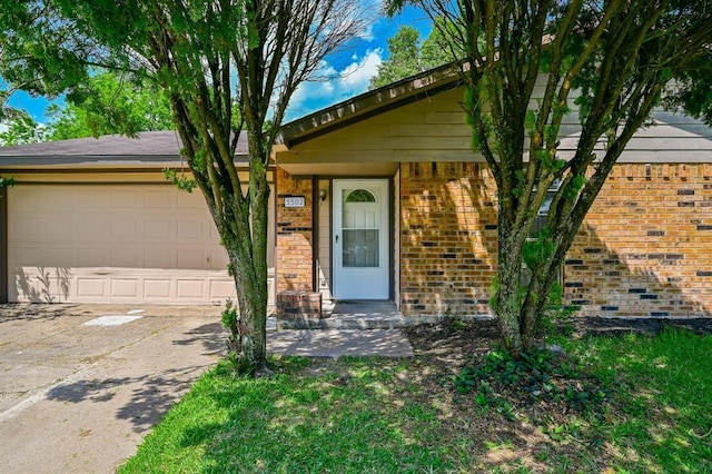 5502 Irish Hill Dr, Houston, TX 77053 - view of front facade with a garage, brick siding, and driveway
