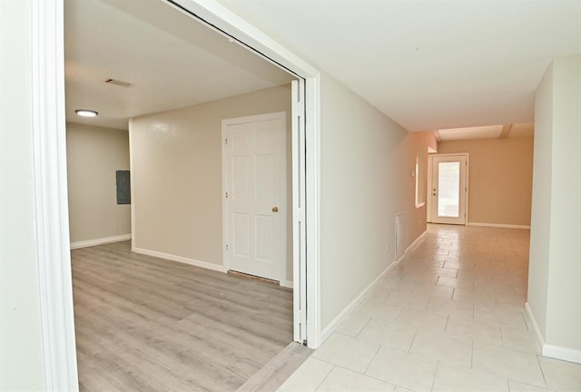 5502 Irish Hill Dr, Houston, TX 77053 - hallway with baseboards and light tile patterned floors