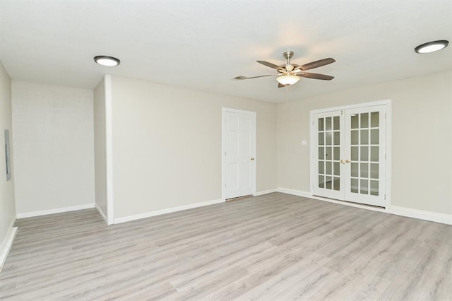 5502 Irish Hill Dr, Houston, TX 77053 - spare room featuring french doors, wood finished floors, a ceiling fan, and baseboards
