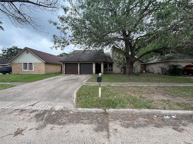 5506 Cactus Forest Dr, Houston, TX 77088 - mid-century home with a garage, a front yard, concrete driveway, and brick siding