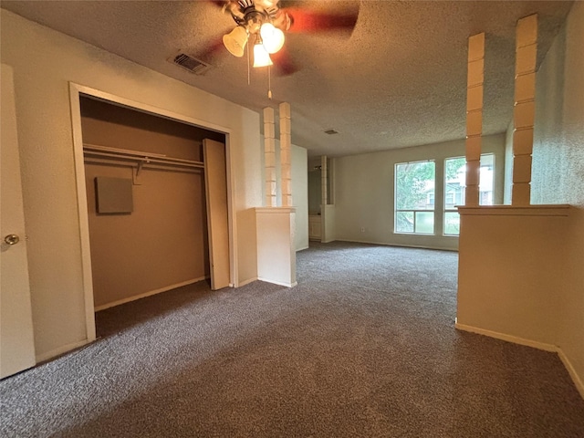 5506 Cactus Forest Dr, Houston, TX 77088 - unfurnished bedroom with carpet, a textured ceiling, ceiling fan, baseboards, and a closet