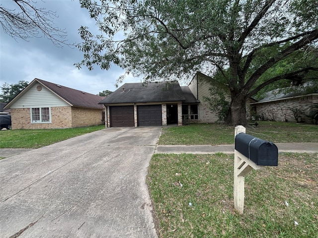 5506 Cactus Forest Dr, Houston, TX 77088 - mid-century home featuring a garage, concrete driveway, brick siding, and a front lawn