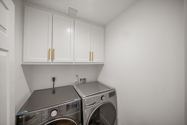 5630 Lymbar Dr, Houston, TX 77096 - laundry room featuring cabinet space and independent washer and dryer