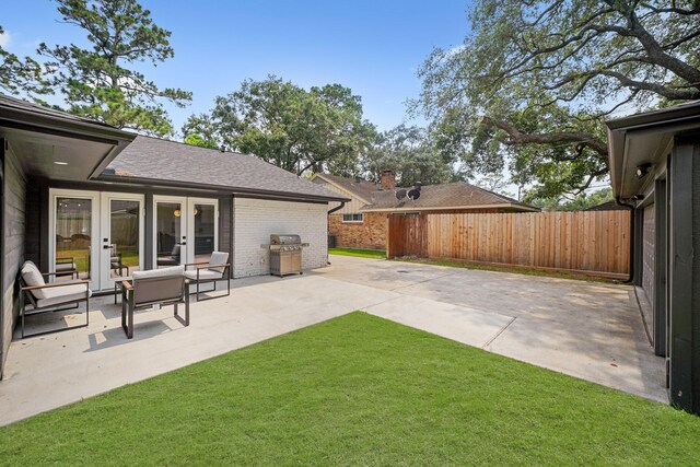 5630 Lymbar Dr, Houston, TX 77096 - view of yard featuring french doors and a patio
