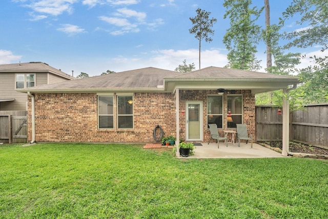 2114 Lost Timbers Dr, Conroe, TX 77304 - back of house with a patio, brick siding, and a shingled roof