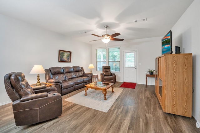 2114 Lost Timbers Dr, Conroe, TX 77304 - living area featuring wood finished floors and ceiling fan