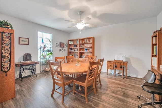 2114 Lost Timbers Dr, Conroe, TX 77304 - dining room featuring wood finished floors, a ceiling fan, and baseboards