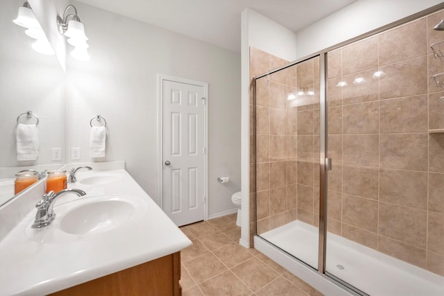 2114 Lost Timbers Dr, Conroe, TX 77304 - full bath featuring double vanity, tile patterned floors, a shower stall, and toilet