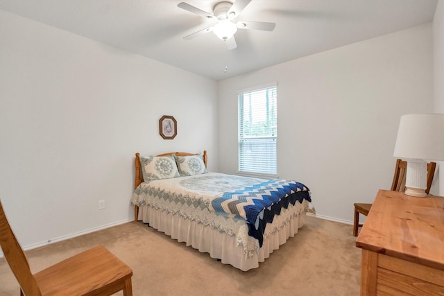 2114 Lost Timbers Dr, Conroe, TX 77304 - bedroom with light colored carpet, baseboards, and a ceiling fan