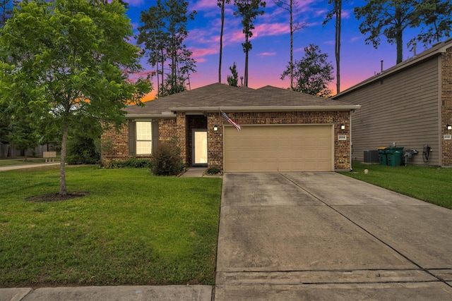 2114 Lost Timbers Dr, Conroe, TX 77304 - ranch-style home with an attached garage, concrete driveway, brick siding, and a yard