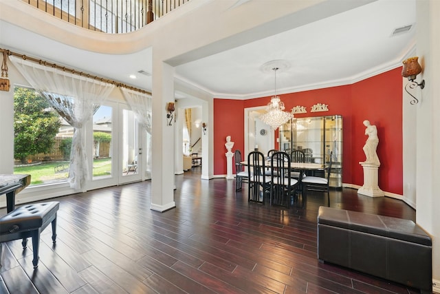 2915 Sentry Oak Way, Sugar Land, TX 77479 - dining room with a chandelier, plenty of natural light, wood finished floors, baseboards, and ornamental molding