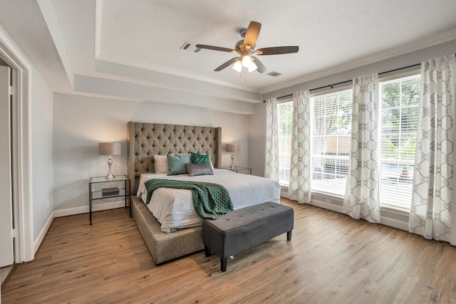 7318 Starbridge Dr, Houston, TX 77095 - bedroom featuring wood finished floors, multiple windows, baseboards, and crown molding