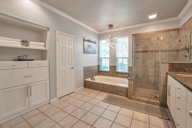 7318 Starbridge Dr, Houston, TX 77095 - bathroom with a shower stall, tile patterned floors, a garden tub, vanity, and a chandelier