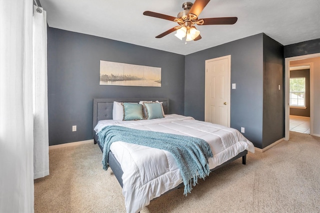 7318 Starbridge Dr, Houston, TX 77095 - carpeted bedroom with baseboards and ceiling fan