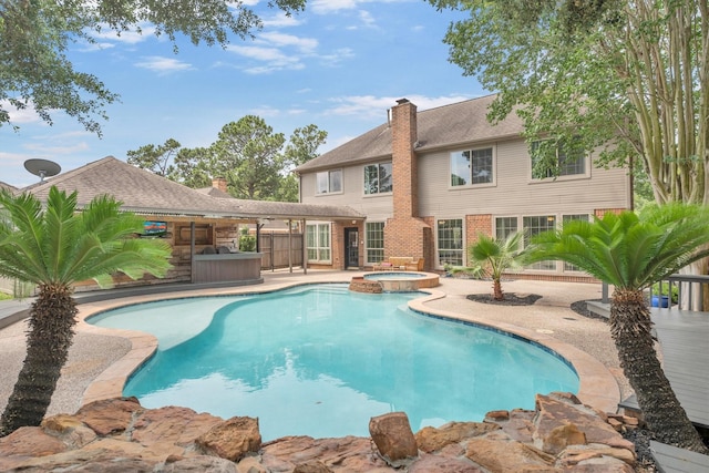 7318 Starbridge Dr, Houston, TX 77095 - view of swimming pool featuring a patio area and a pool with connected hot tub