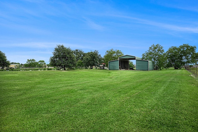 4201 Lawrence Rd, Beach City, TX 77523 - view of yard with a carport, an outdoor structure, and a pole building