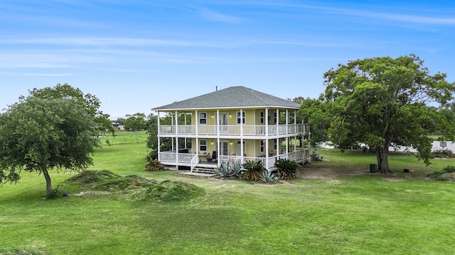 4201 Lawrence Rd, Beach City, TX 77523 - rear view of house with a balcony, a lawn, covered porch, and roof with shingles