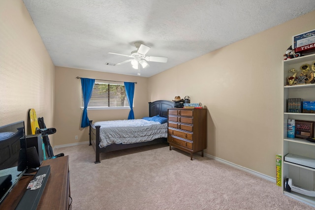 489 Merrimac Park, Conroe, TX 77302 - bedroom featuring carpet, a textured ceiling, a ceiling fan, and baseboards
