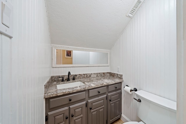 489 Merrimac Park, Conroe, TX 77302 - half bath with vanity, toilet, and a textured ceiling