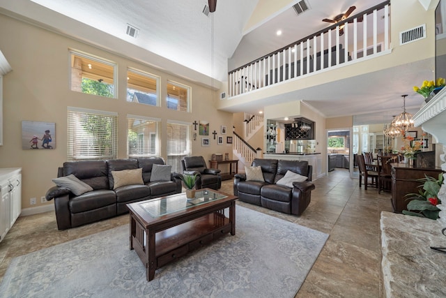 489 Merrimac Park, Conroe, TX 77302 - living area with a high ceiling, stairway, a chandelier, and baseboards