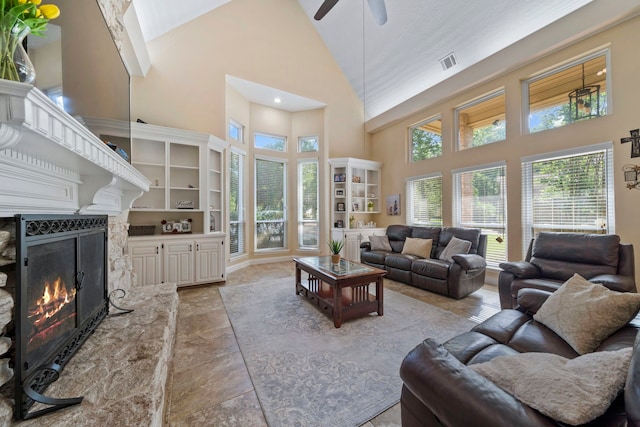 489 Merrimac Park, Conroe, TX 77302 - living area with high vaulted ceiling, ceiling fan, healthy amount of natural light, a warm lit fireplace, and recessed lighting