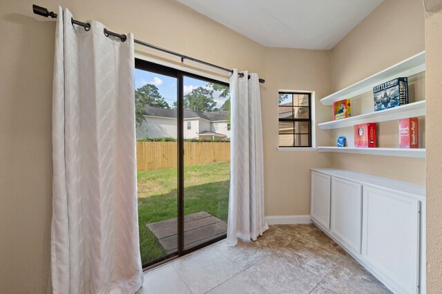 489 Merrimac Park, Conroe, TX 77302 - doorway to outside featuring light tile patterned floors