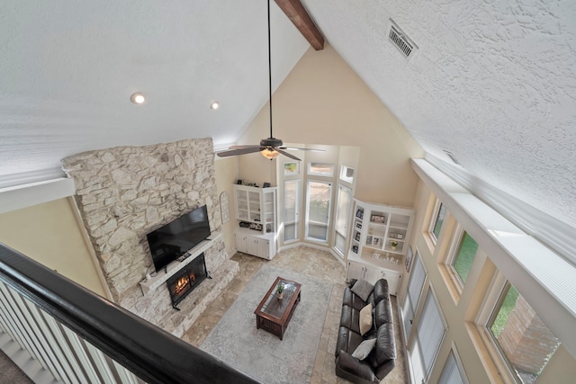 489 Merrimac Park, Conroe, TX 77302 - living room featuring a stone fireplace, high vaulted ceiling, beamed ceiling, a ceiling fan, and recessed lighting