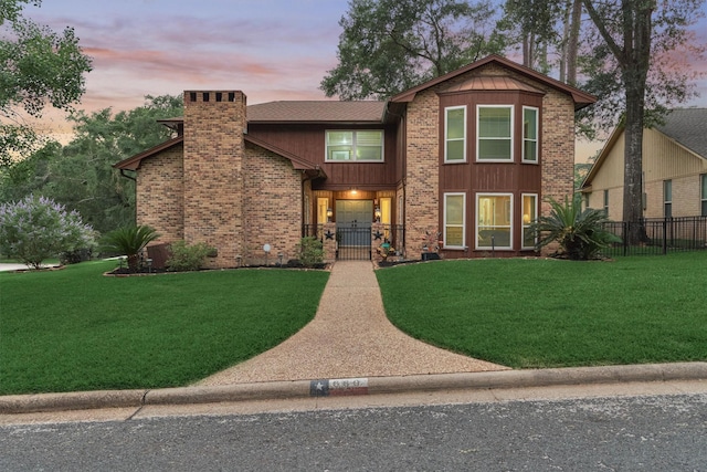 660 Hillcrest Dr, Huntsville, TX 77340 - view of front of home featuring a chimney, a gate, and brick siding