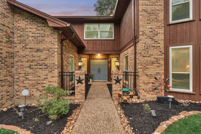 660 Hillcrest Dr, Huntsville, TX 77340 - exterior entry at dusk with brick siding