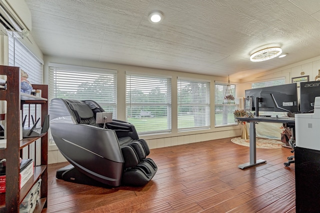 660 Hillcrest Dr, Huntsville, TX 77340 - workout area with wood finished floors and a textured ceiling
