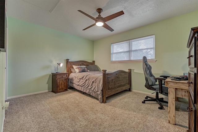 660 Hillcrest Dr, Huntsville, TX 77340 - bedroom featuring light colored carpet, baseboards, a ceiling fan, and a textured ceiling