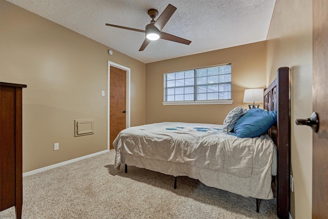 660 Hillcrest Dr, Huntsville, TX 77340 - bedroom with a textured ceiling, carpet flooring, a ceiling fan, and baseboards