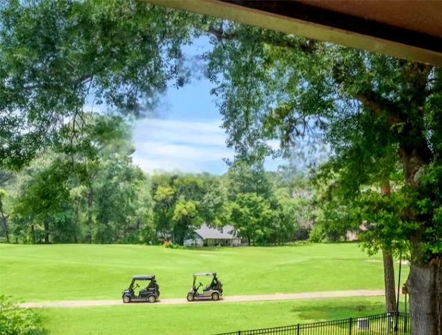 660 Hillcrest Dr, Huntsville, TX 77340 - view of property's community with view of golf course and view of wooded area
