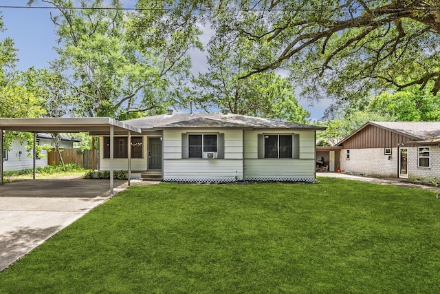 1848 Kipling St, Liberty, TX 77575 - ranch-style house with entry steps, driveway, and a carport
