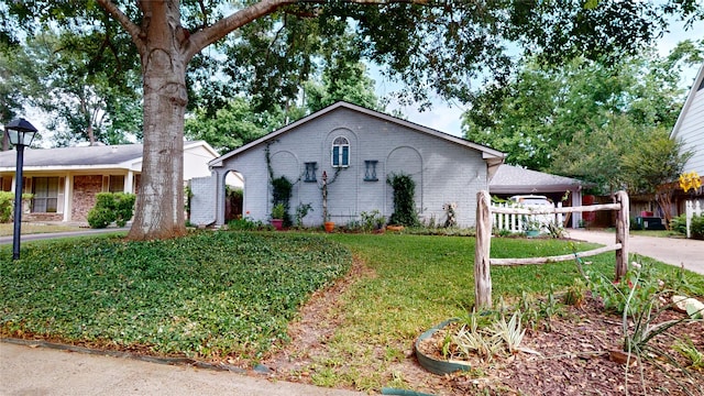 9723 Dalmally St, Spring, TX 77379 - single story home featuring concrete driveway, brick siding, and a front yard