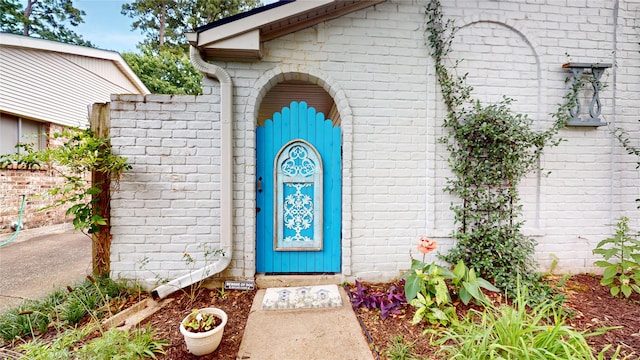 9723 Dalmally St, Spring, TX 77379 - doorway to property featuring brick siding