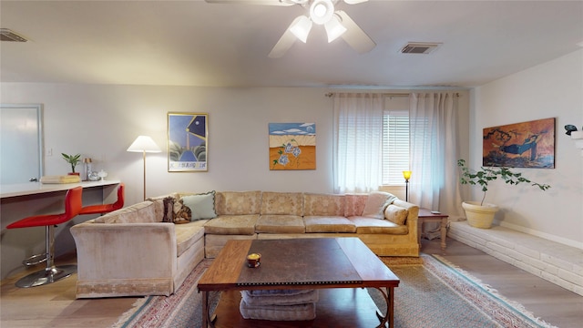 9723 Dalmally St, Spring, TX 77379 - living room with wood finished floors, a ceiling fan, and baseboards