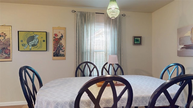 9723 Dalmally St, Spring, TX 77379 - dining area featuring baseboards