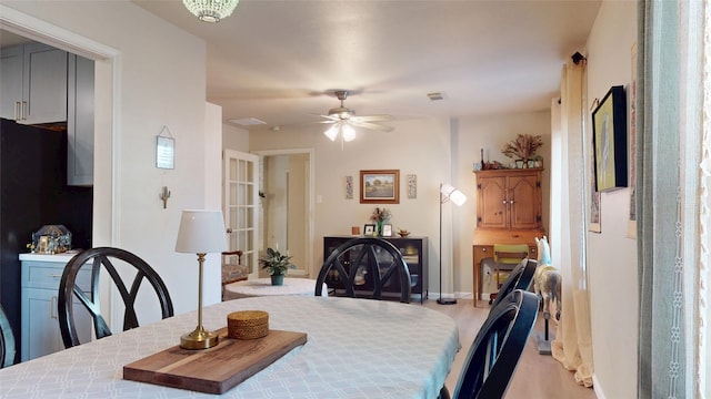 9723 Dalmally St, Spring, TX 77379 - dining area with light wood-style floors, ceiling fan, and baseboards