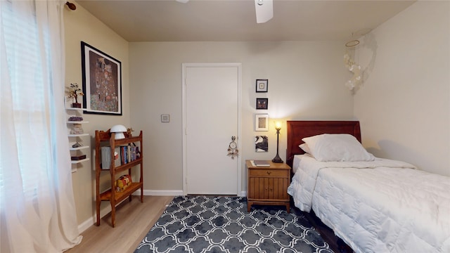 9723 Dalmally St, Spring, TX 77379 - bedroom featuring wood finished floors, baseboards, and a ceiling fan