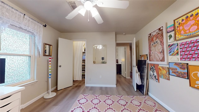 9723 Dalmally St, Spring, TX 77379 - bedroom featuring light wood-style floors and baseboards