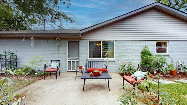 9723 Dalmally St, Spring, TX 77379 - back of house featuring brick siding and a patio area