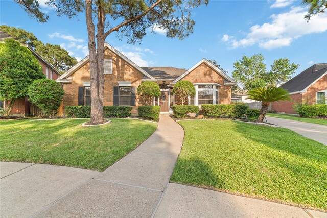 16919 Shady Square Ct, Houston, TX 77095 - traditional-style home with a front lawn and brick siding