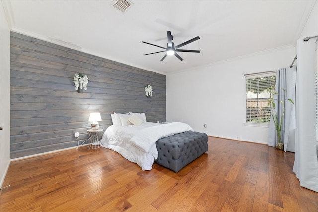16919 Shady Square Ct, Houston, TX 77095 - bedroom featuring baseboards, ornamental molding, hardwood / wood-style flooring, wood walls, and ceiling fan