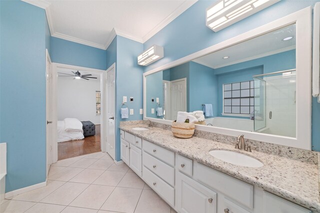 16919 Shady Square Ct, Houston, TX 77095 - ensuite bathroom featuring double vanity, ornamental molding, a stall shower, a garden tub, and tile patterned floors