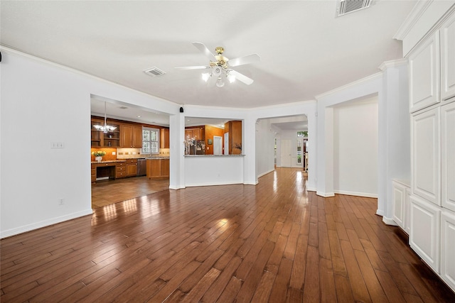 1930 Hollys Way, Sugar Land, TX 77479 - unfurnished living room featuring ceiling fan, dark wood-style flooring, arched walkways, baseboards, and crown molding