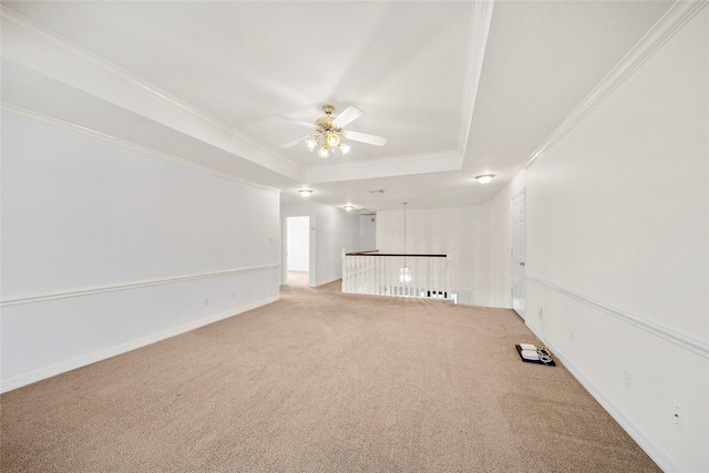 1930 Hollys Way, Sugar Land, TX 77479 - unfurnished living room with a tray ceiling, light colored carpet, a ceiling fan, ornamental molding, and baseboards