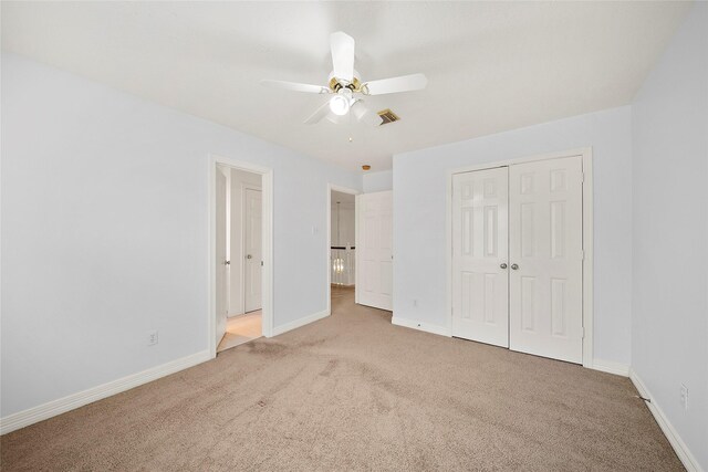 1930 Hollys Way, Sugar Land, TX 77479 - unfurnished bedroom with carpet flooring, baseboards, a closet, and a ceiling fan