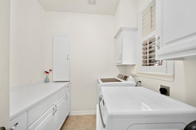 1930 Hollys Way, Sugar Land, TX 77479 - laundry room featuring cabinet space, washer and dryer, light tile patterned flooring, and baseboards